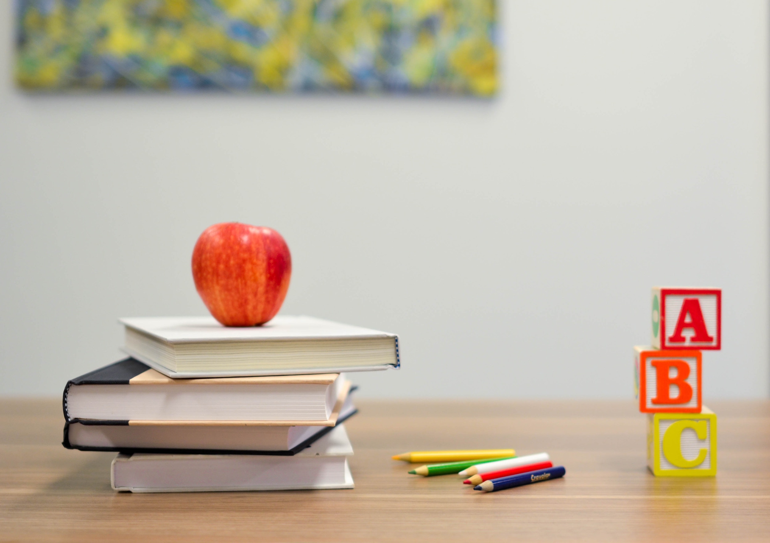 Apple on pile of books